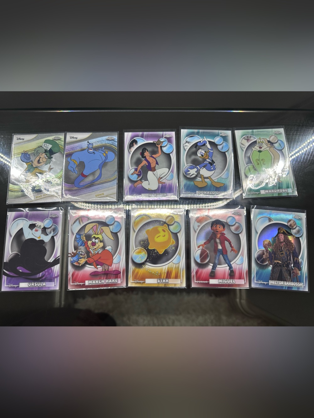 Assortment of 38 refractor Topps Disney & Pixar cards all brand new